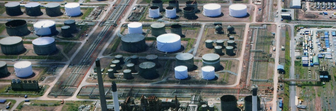 An aerial image of an oil refinery taken with a drone conducting a flare stack inspection