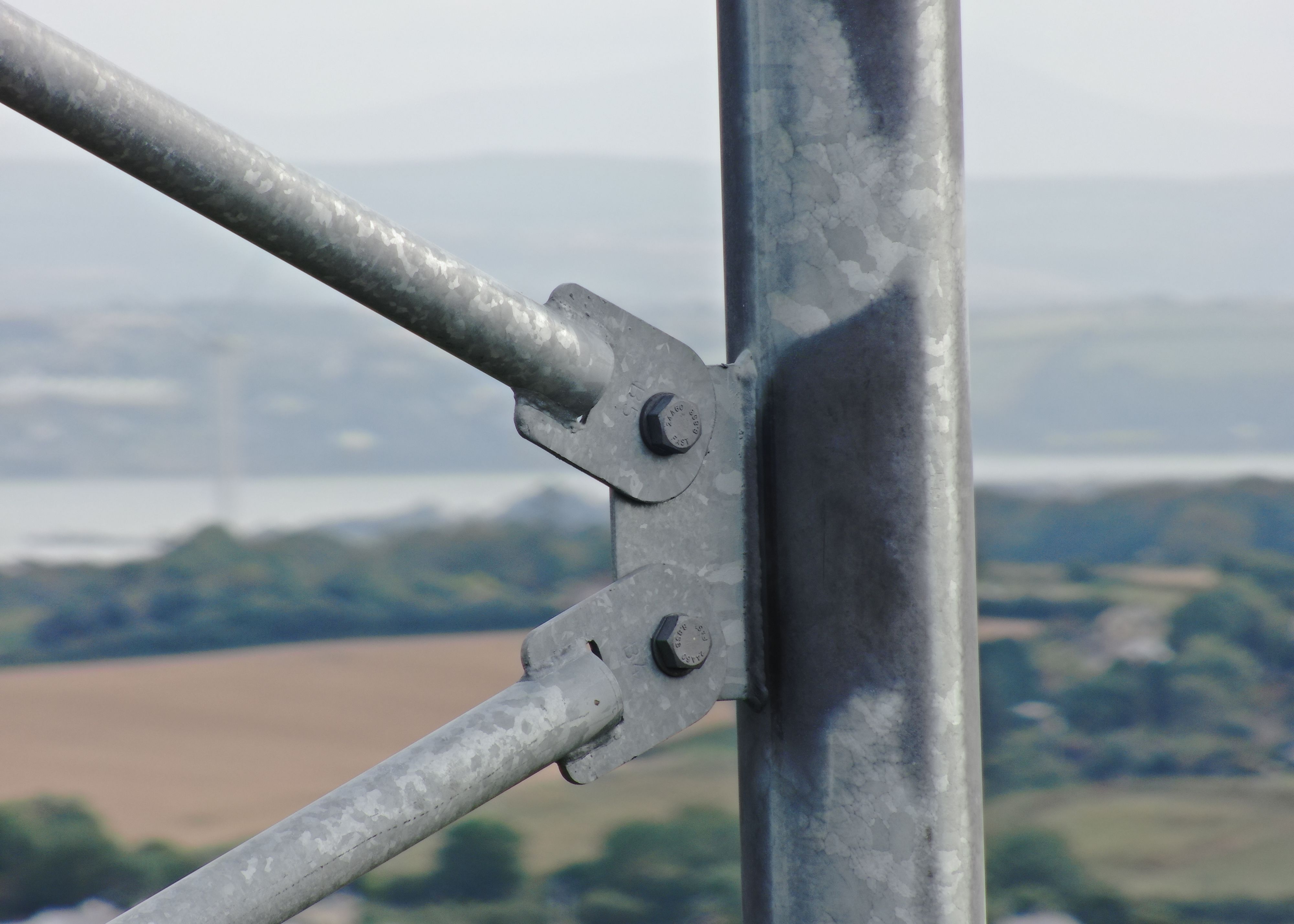 Close up of two bolts on a large steel tower