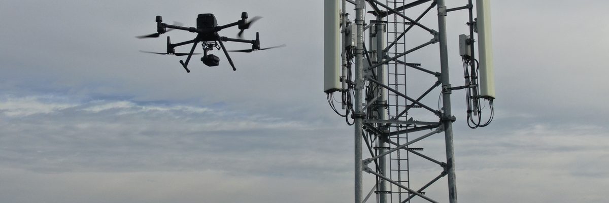 A cell tower inspected by a drone