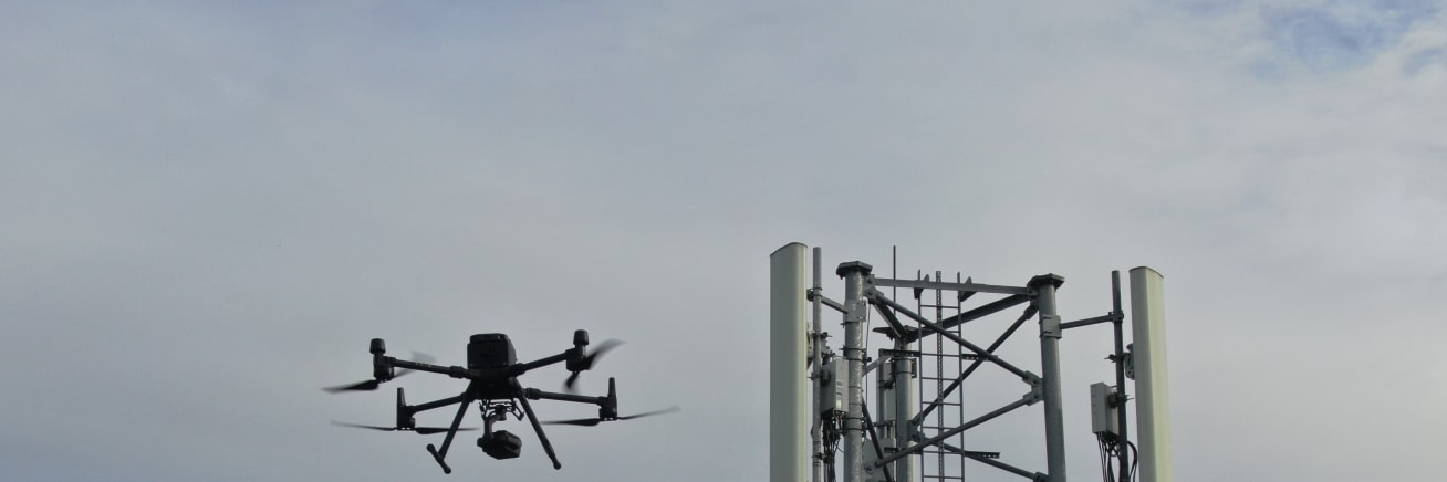 A cell tower inspected by a drone