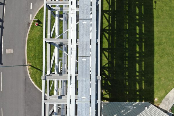 An aerial image of a pipe rack in a pharma facility