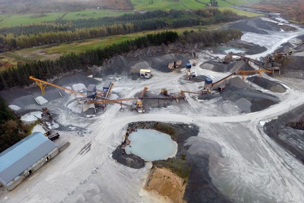 A quarry processing area being inspected by a drone