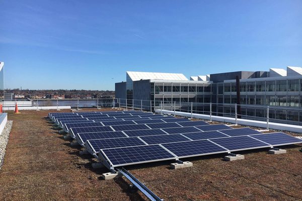 A rooftop solar array photographed from above during a drone inspection