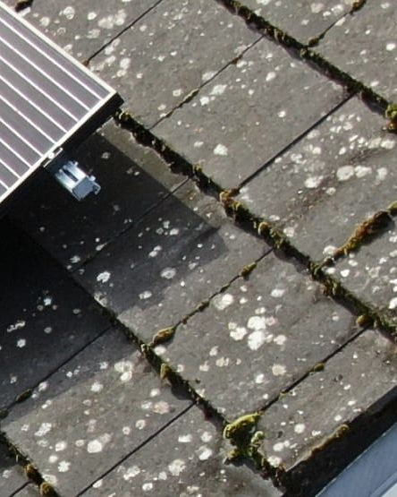 A photo taken by a drone of rooftop solar panels during an inspection